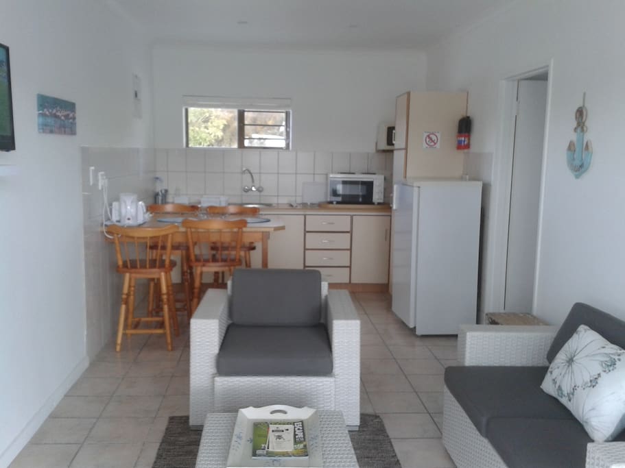 Suite 1. Open plan kitchenette and sitting room with TV