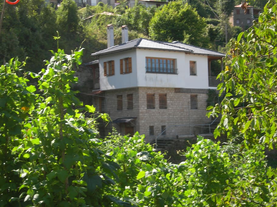view of the house. upper floor is the living room and fire place, kitchen and 0,5 bathroom. down floor there are the two bedrooms, bathroom and a kitchen. first floor is the basement.