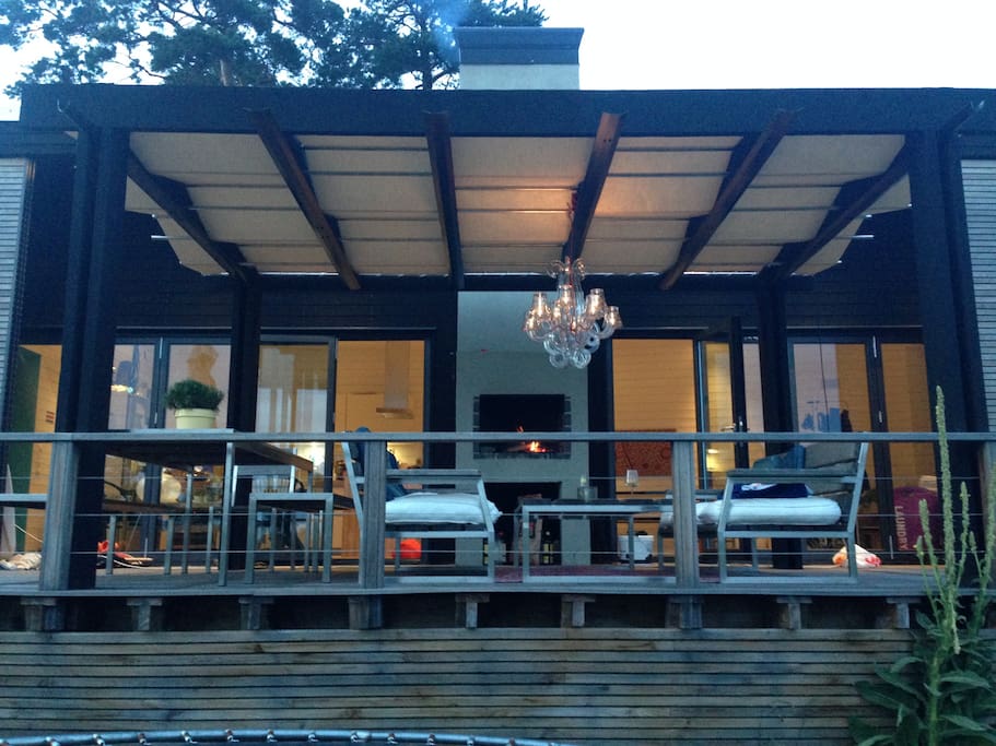 Covered lounge area infront of the outside fireplace