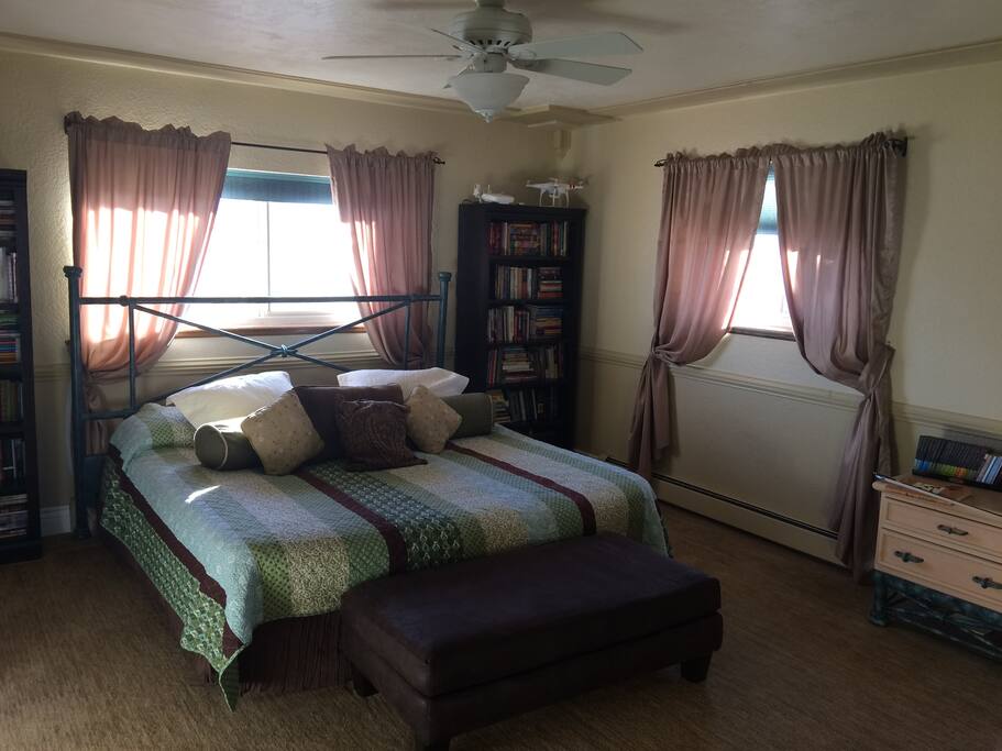Large private room with King size bed, right next to your private bathroom, and TV room.