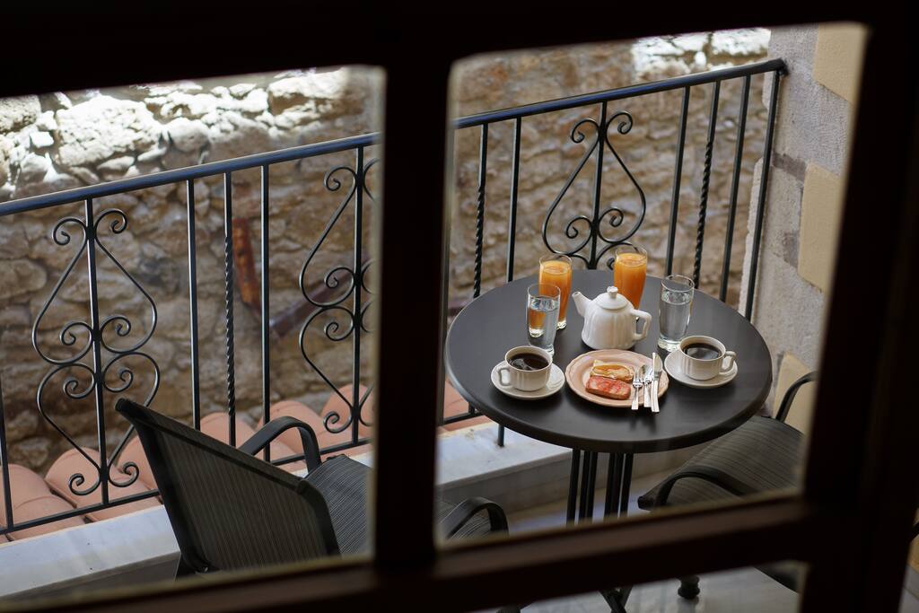 Coffee table with chairs on our balcony on the first floor