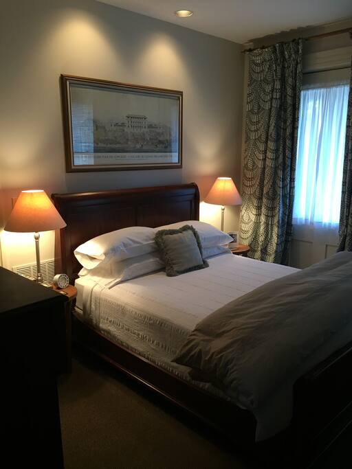 Queen-sized bed is well-appointed with freshly ironed pillowcases and option of down or hypoallergenic pillows