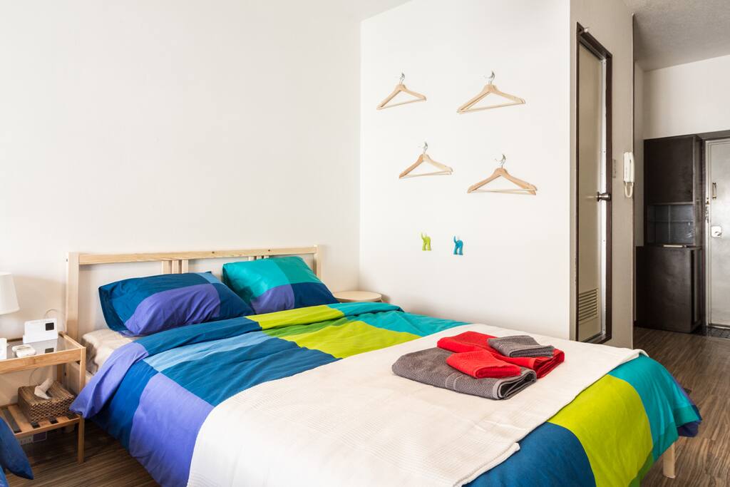 Double bed in the apartment onto the entrance