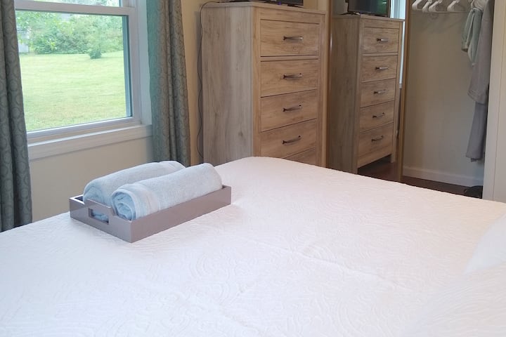 Awaken to lots of Natural Light as well as Curtains/Blinds with just a Bit of a Country Ambiance. Same room, different angle to show chest