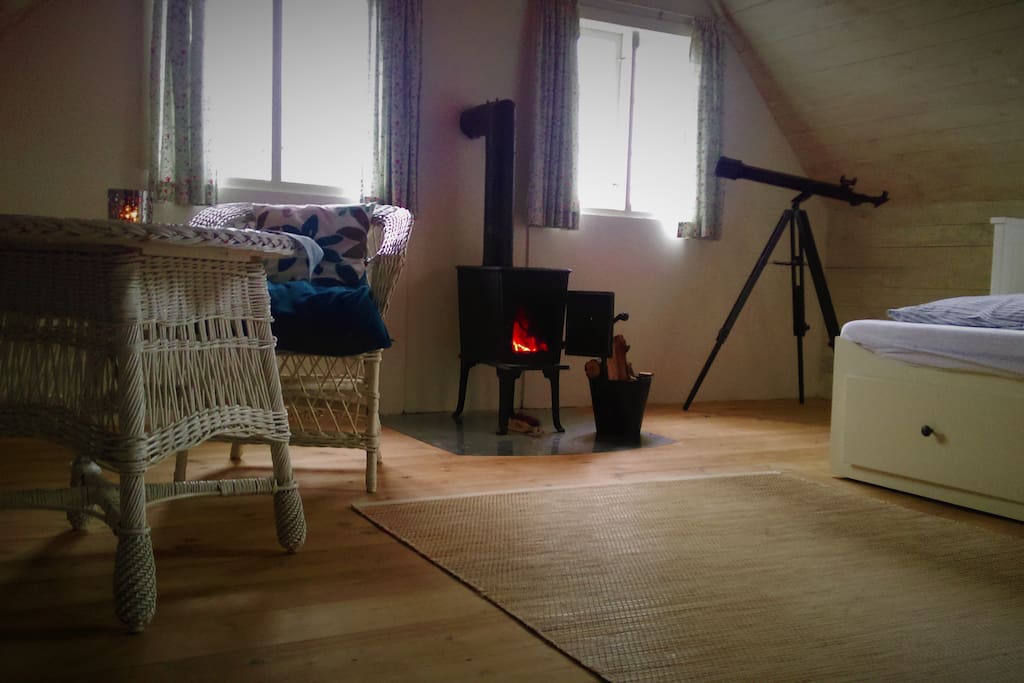 Peaceful family bedroom with its own woodburning stove