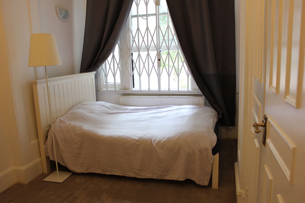 King size bed, with view over the private garden.