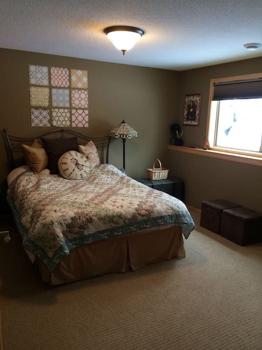 One large spacious bedroom with Queen bed, closet, room darkening shades, and door lock.