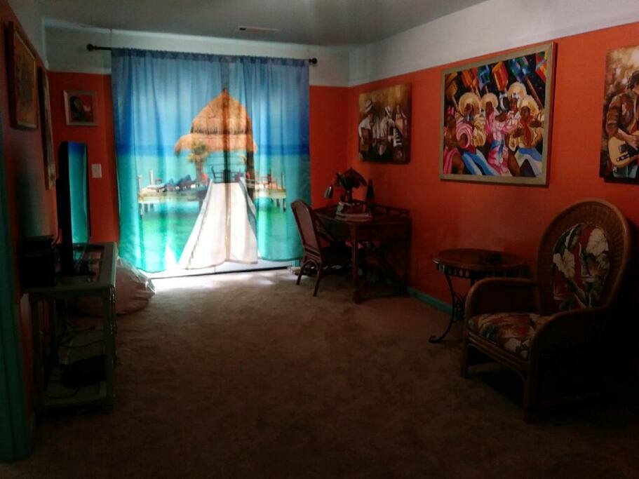 Living Room with cable television. Chairs & table will be replaced with couch soon.
