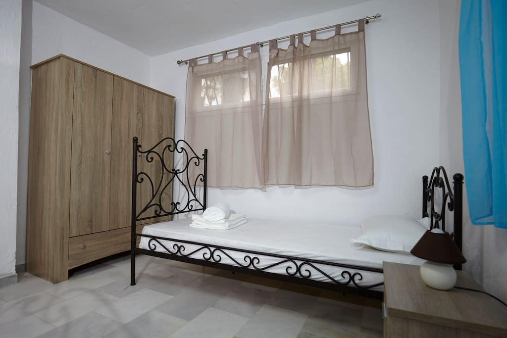 Bedroom with one double and one single bed
