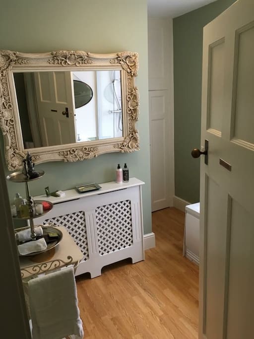 Bath with shower over and wash basin