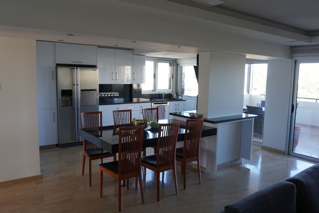 Kitchen area with dinning table and 6 chairs.