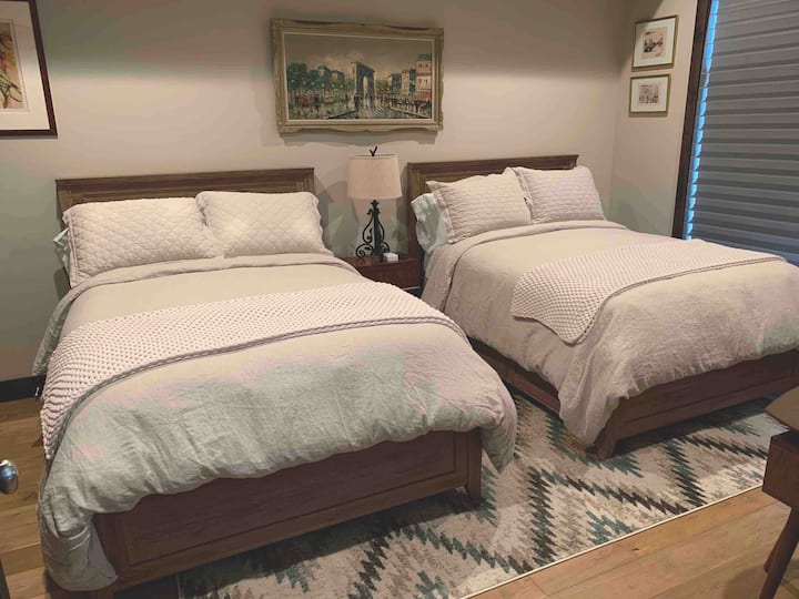 Second bedroom with en-suite bath. Deep full-sized bathtub to relax in after a full day outdoors. Motorized blind with room darkening shade for a good night’s sleep.