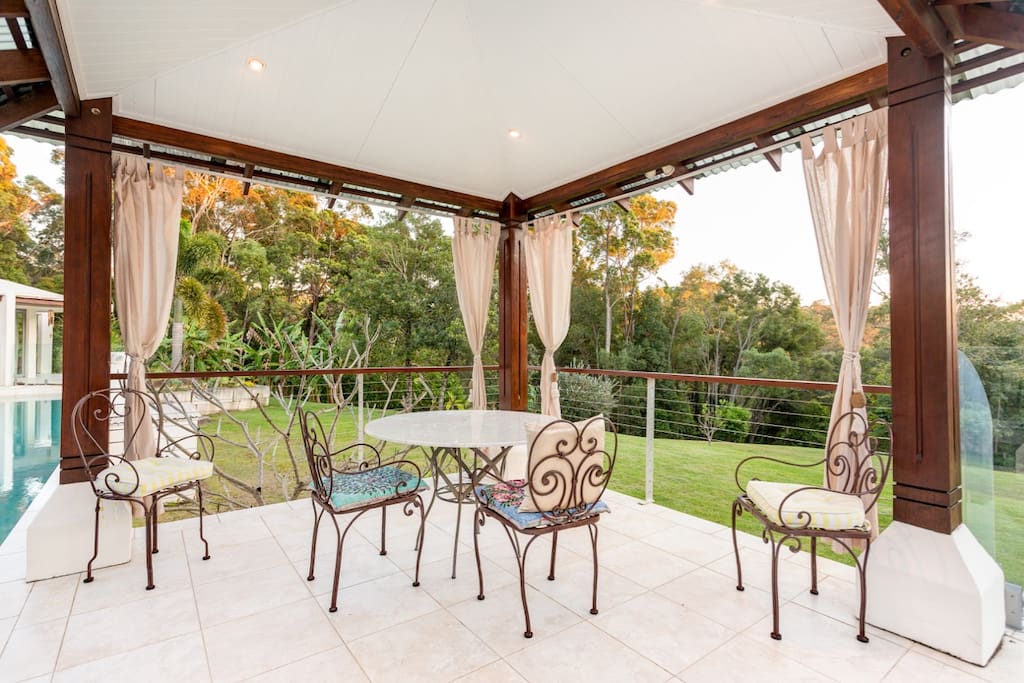 Gazebo for breakfast by the pool overlooking the garden.