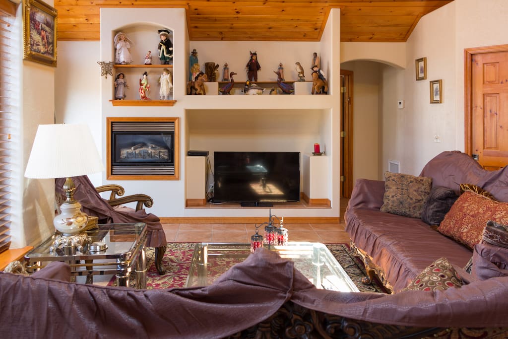 Living room featuring Smart TV , Gas Fireplace and comfy couches