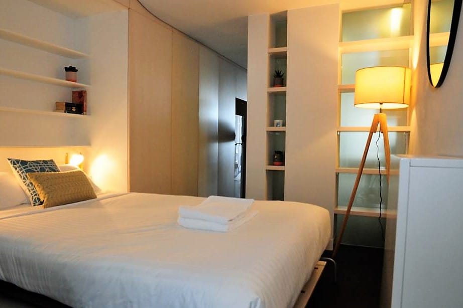 A comfortable bed for you with plenty of shelves and wardrobe space on either side. 