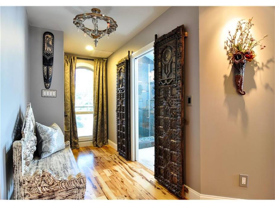 Hallway is adorned with antiques from India.