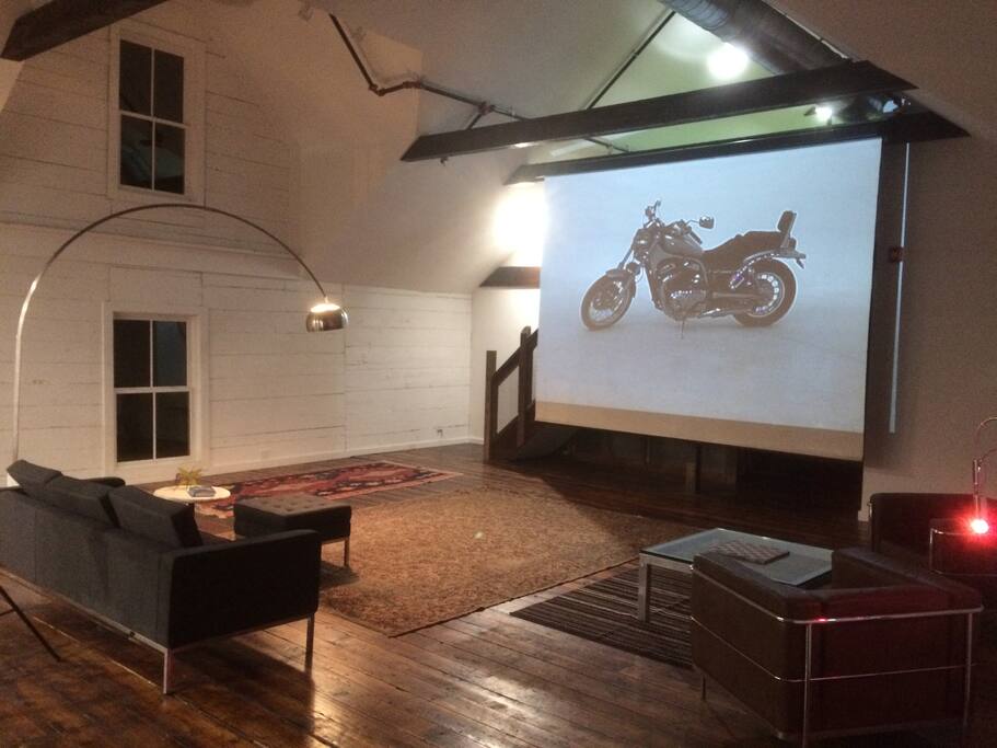 Open Living Area with Pull Down Screen