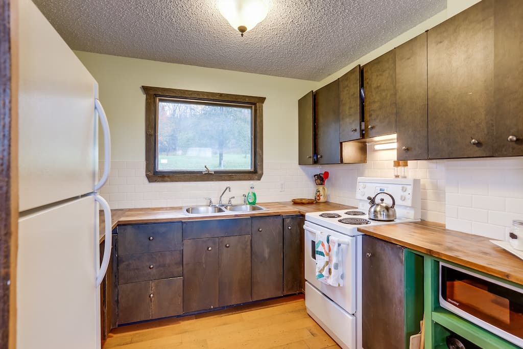 Small country kitchen overlooks the orchard