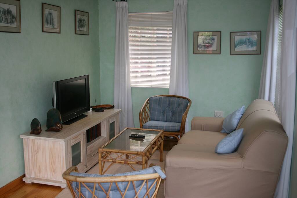 Open plan lounge off dining area with full DSTV