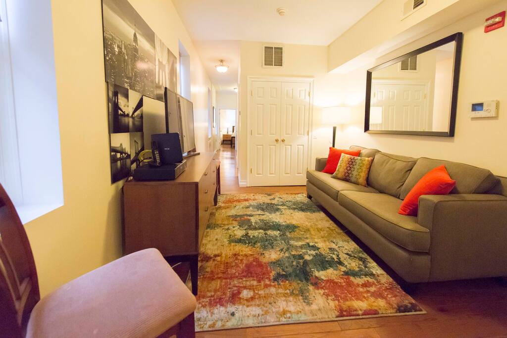 Living room with 50" flat screen HDTV TV and full size sleeper sofa