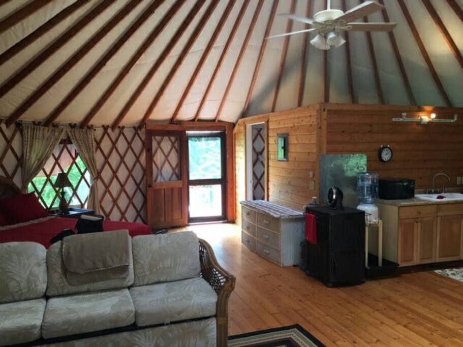 open concept living room, bedroom and kitchen