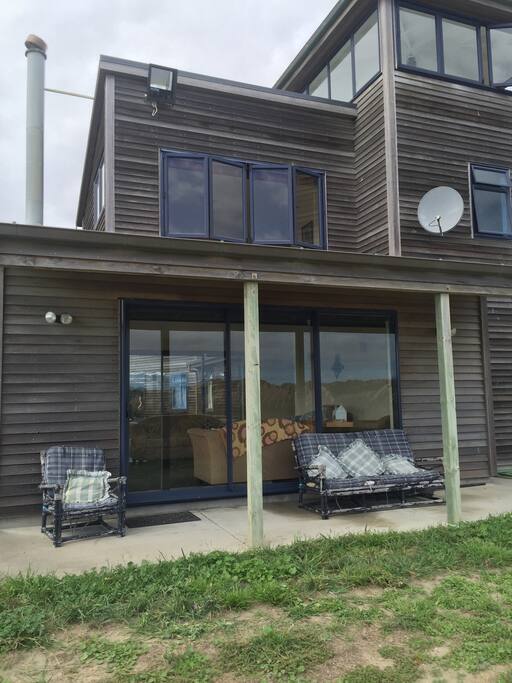 The house is laid back, for easy living -built of cedar with oversize glass doors