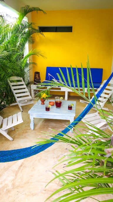 Enjoy relaxing on the patio surrounded by tropical garden