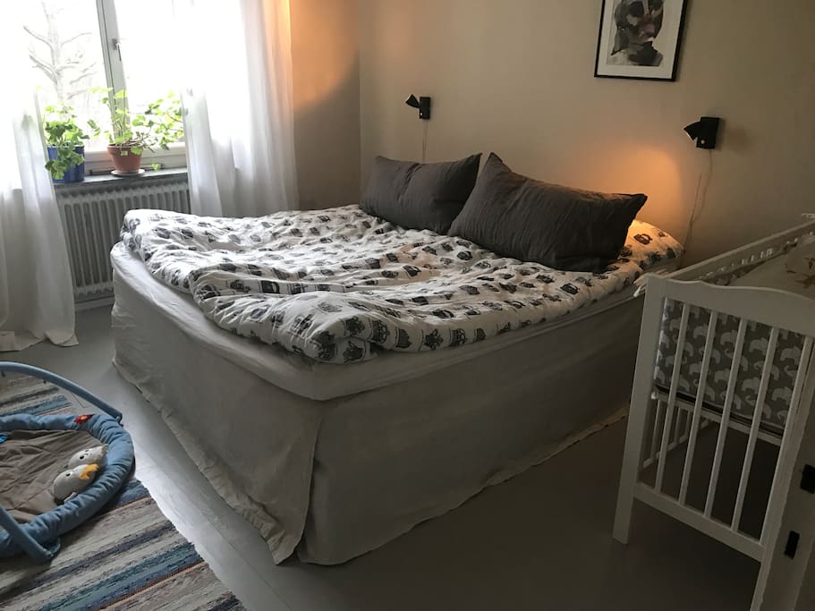 Bedroom with comfy double bed and cot for babies/small children