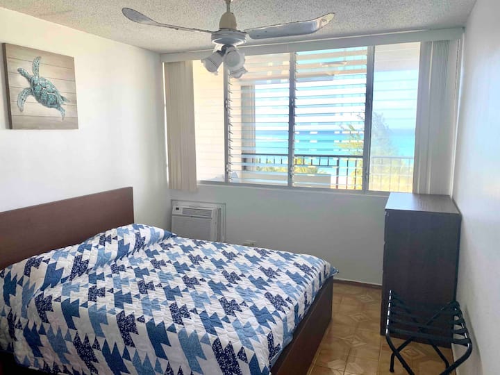 Queen size bed, air conditioner, ceiling fan, dresser draw, closet, and luggage rack. Bedroom closet has beach chairs, game folding table, folding chairs, boggie boards, etc.
