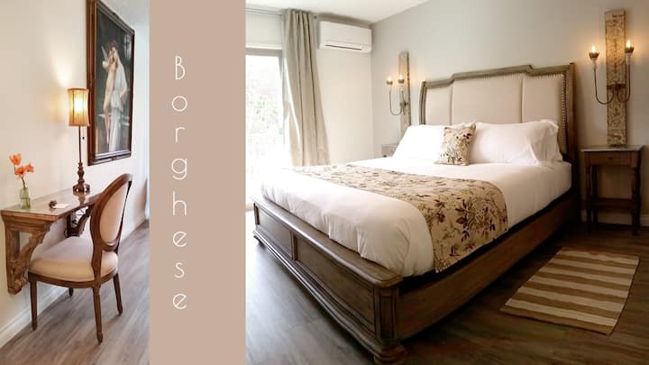 The "Borghese" Garden... featuring washed woods, Italian decor & textiles, & the warmth of Italian gardens!  Plush King bed, private en suite bath, personal heat & air-conditioning,  TV, desk, & a deck overlooking the back gardens and water feature! 