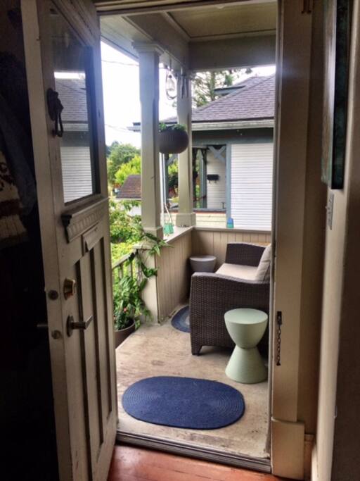 Sunny porch on a quiet street.