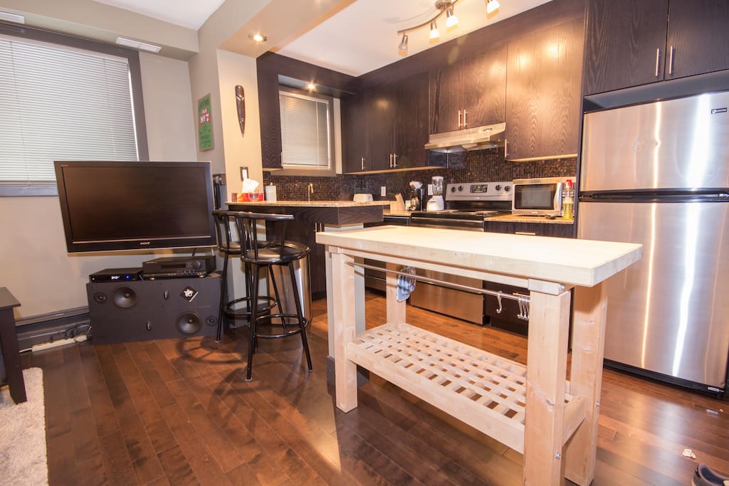 Open concept kitchen with butchers block table