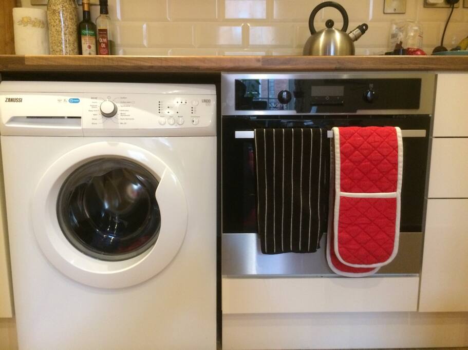 Full kitchen with utensils and brand new appliances.