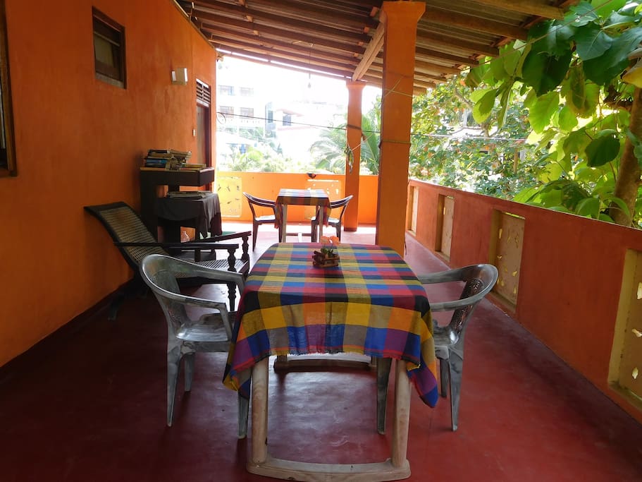 Rooms upstairs have a balcony with a table and chairs for your relax time