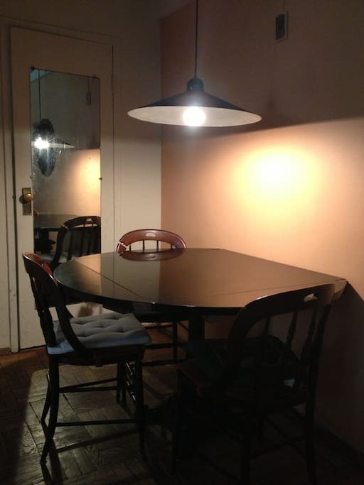Dining area with overhead lamp.