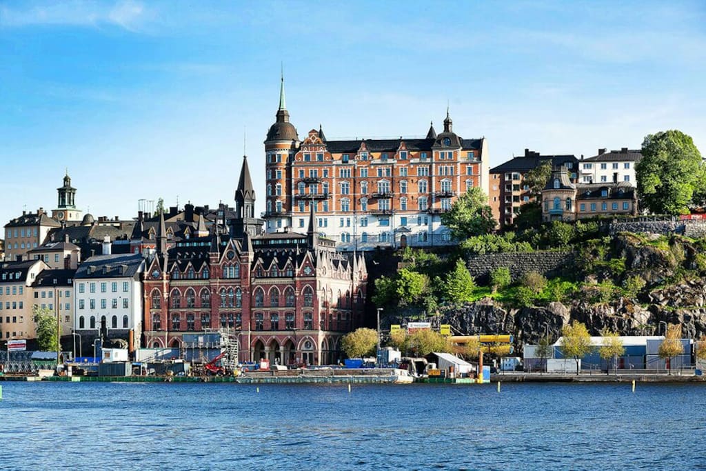 Södermalm, 10 min away by train or after two stops.