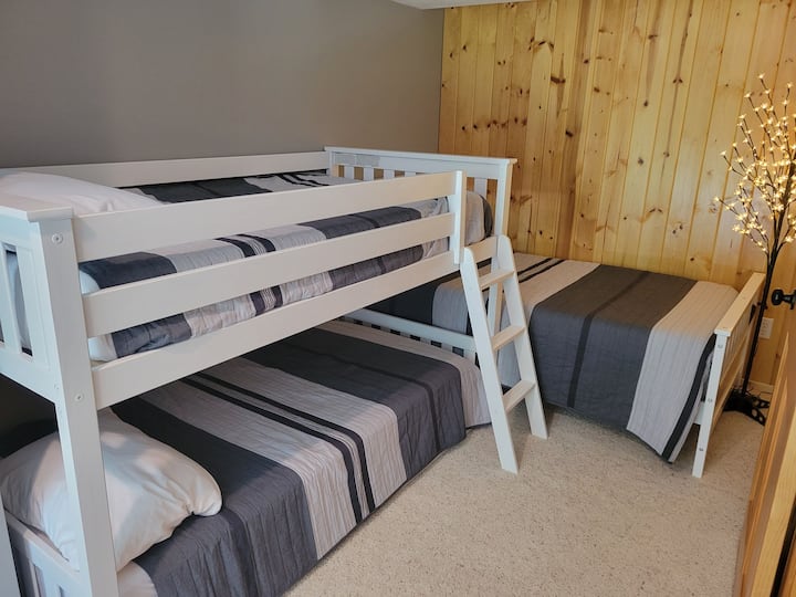 "Bunk" room in the basement with 3 twin beds.