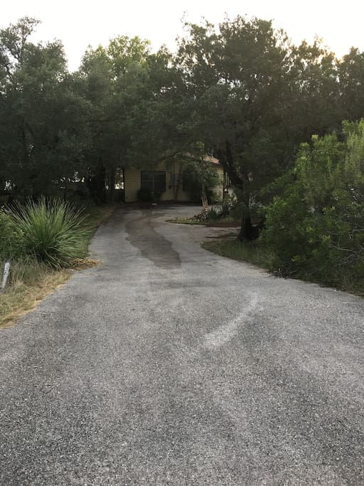 Driveway leading down to house