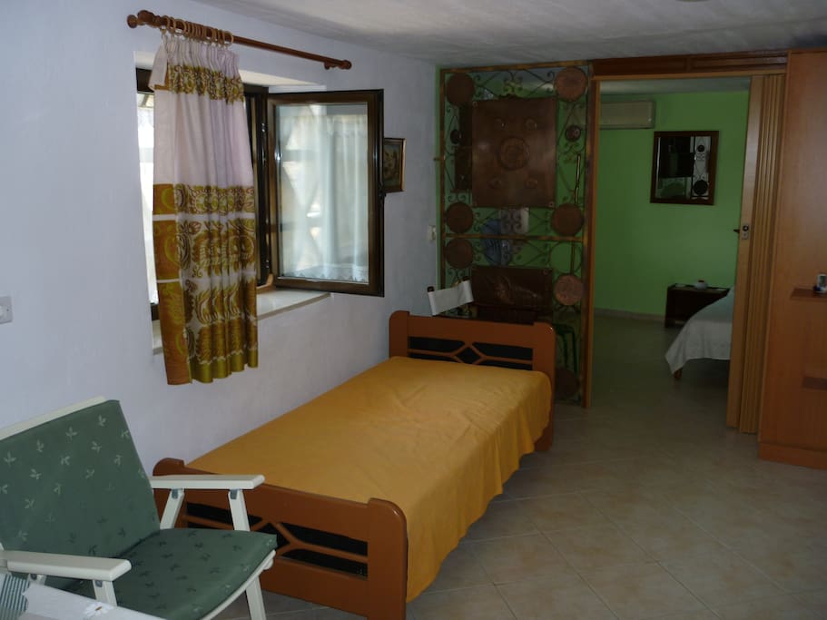 Single bed in open plan sitting room