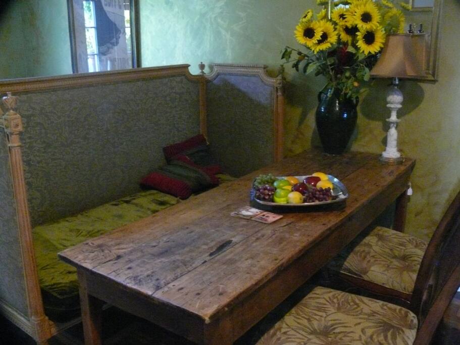 A 19th century French country table in the kitchen is an inviting place to share a cup of morning coffee with friends and family.