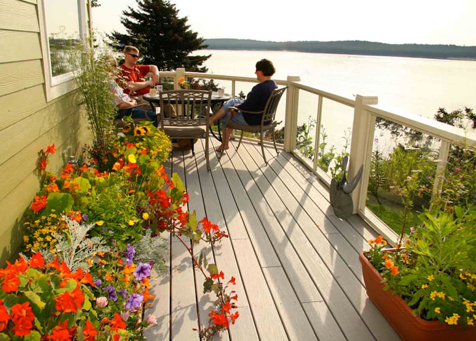 Guests enjoy morning coffee on the deck