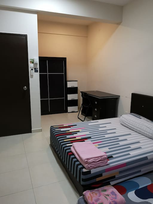 Spacious bedroom with working desk