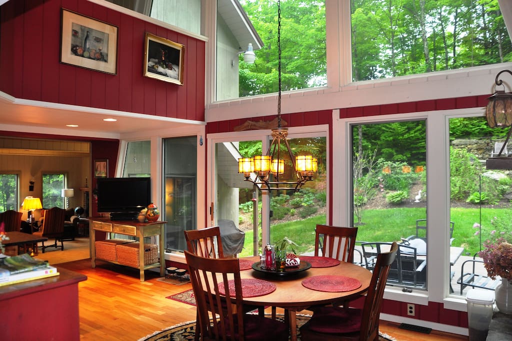Bright kitchen eatery with fireplace brings the outside in