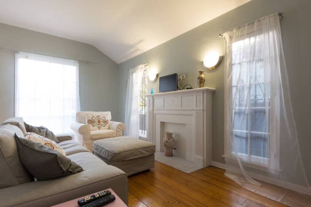 A spacious sitting room with smart TV
