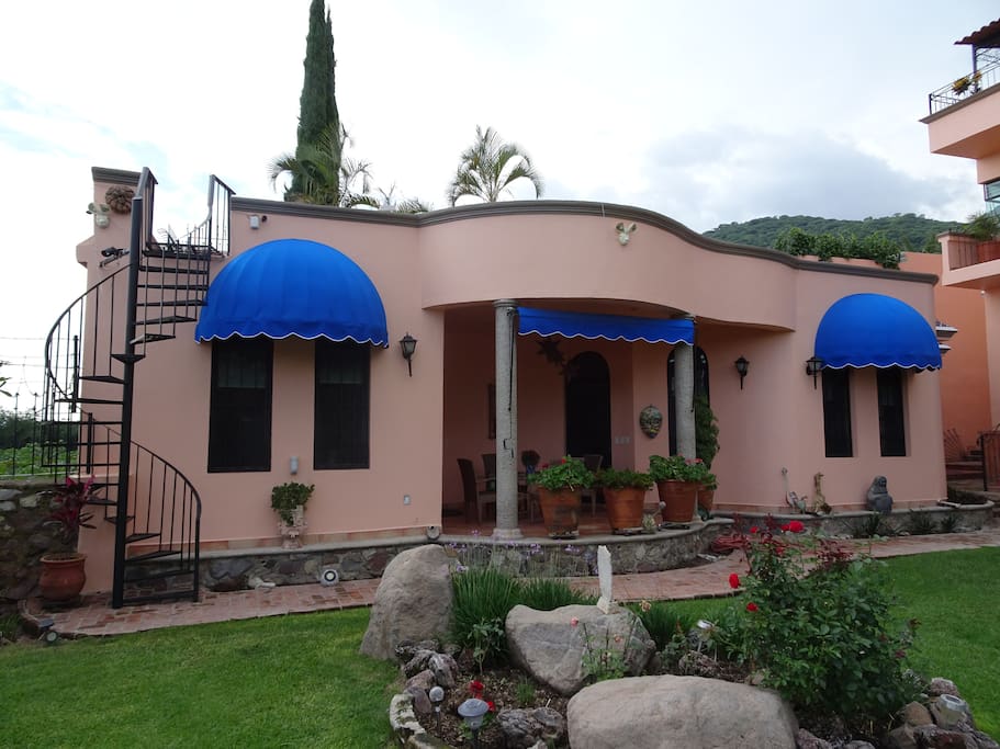 Front view of casita. Staircase to your own mirador with views of the mountains and lake.