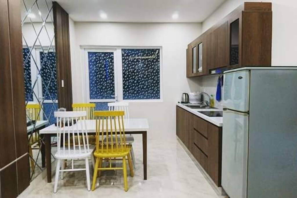Full equipped kitchen, dinning table. Open the door to the balcony