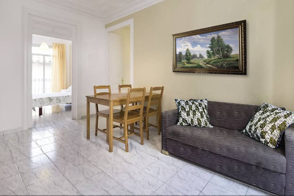 Living room with sofa and dining table