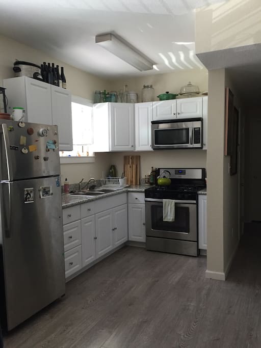 Gas stove, double-sided sink, full size fridge/freezer.