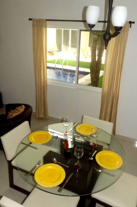 dining area looking onto the swimming pool