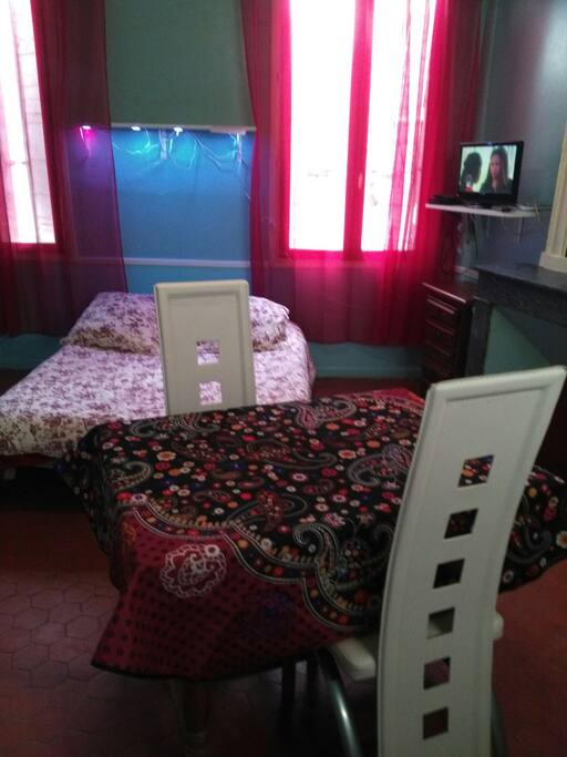 bed with table and tv